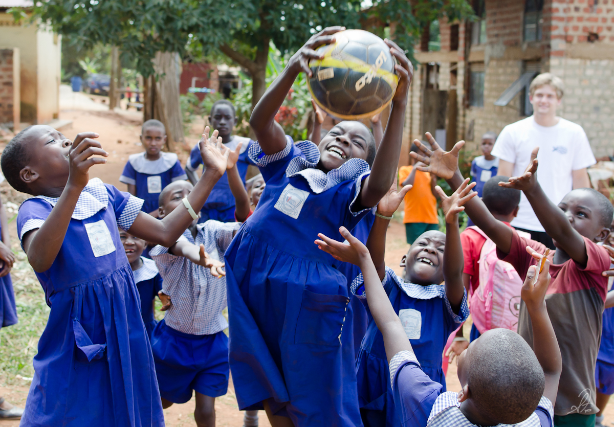 Kids in Buloba School Catch Soccer Ball