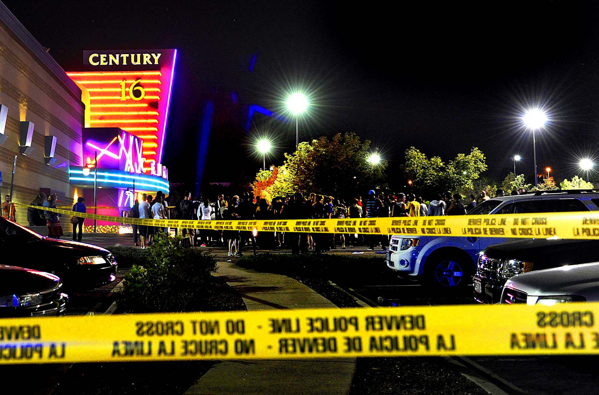 People gather outside the Century 16 movie theater in Aurora, Colorado, at the scene of the mass shooting. (Karl Gehring/Associated Press)